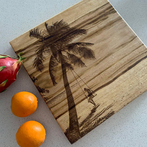 Laser engraved chopping board with palm tree design