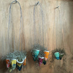 Small hand sculpted hanging pot with Spanish moss