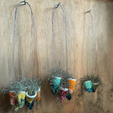 Small hand sculpted hanging pot with Spanish moss